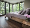 Modern home with Bedroom, Bed, Night Stands, and Medium Hardwood Floor. Builder John Kraemer & Sons’ Lake Calhoun Organic Modern residence, winner of 2016 Integrity Red Diamond Achiever Award Photo of Lake Calhoun Organic Modern