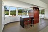 Modern home with Kitchen, Light Hardwood Floor, Ceiling Lighting, and Refrigerator. Architect Greg Wiedmann’s Modern Farm House residence Photo 6 of Modern Farm House