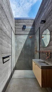 Balnarring Retreat is a minimal residence located in Victoria, Australia, designed by Branch Studio Architects. The retreat embraces a low-tech aesthetic towards the operation of the building itself, fully embodying the idea of retreat and slowing down. Celebrating craftsmanship and integrity of materiality instead of technology, every wall of the building have been designed to contain components that manually fold, open and close to manipulate the space and transform the program of the building.