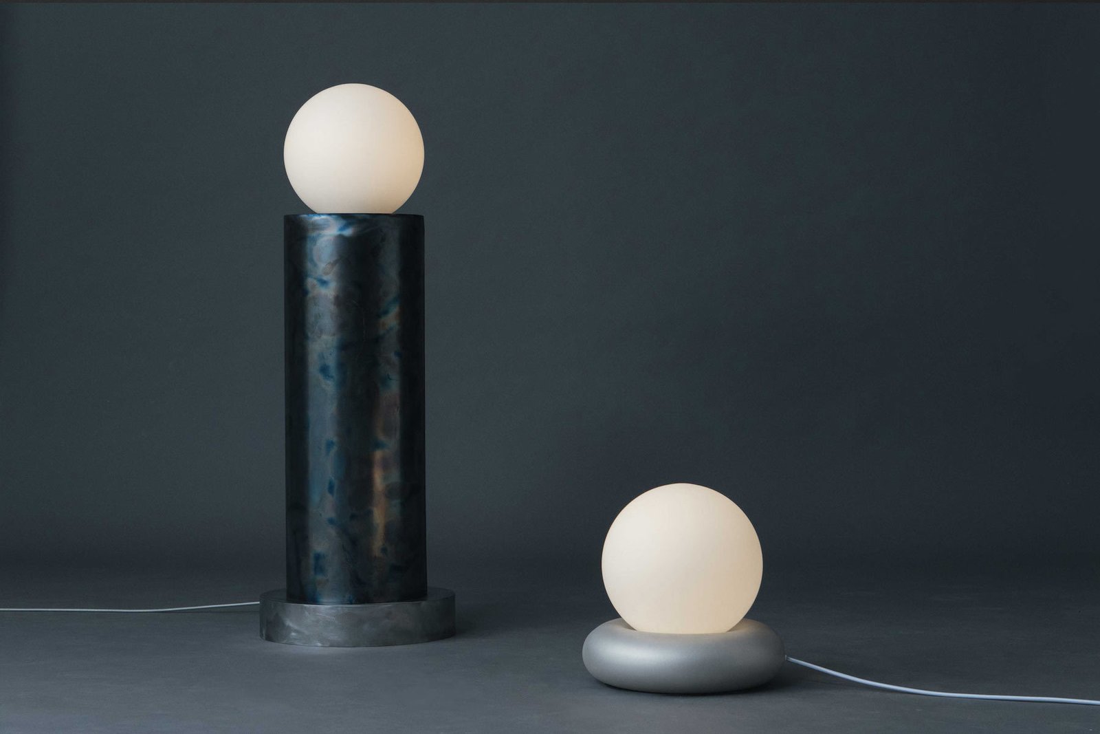 Lighting Collection #1 is a minimal collection of lighting created by Stockholm-based designers HAHA Studio. Lighting Collection #1 is a celebration of metal, material and light. The collection is a continuation of HAHA’s previous work and form language. Instead of focusing on form, here the emphasis is on the material itself, allowing room for the material to speak. Lighting Collection #1 consists of two floor lamps, a table lamp, a wall lamp, a pendant lamp and a set of candle holders.