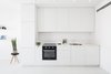Modern home with Kitchen, White Cabinet, Track Lighting, Painted Wood Floor, Granite Counter, Cooktops, Wall Oven, and Drop In Sink. A minimalist interior located in Tel-Aviv, Israel, has been designed by Yael Perry. The apartment was renovated and includes a bright living space, kitchen, and one bedroom, along with a wide bathroom. The designer, who wanted to provide a unique aesthetic that also made the space feel more spacious and bright, chose to design the apartment in one shade of color: white.
Photo 20 of S|H Apartment