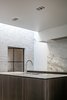 Modern home with Kitchen, Marble Counter, Marble Backsplashe, Ceiling Lighting, Recessed Lighting, and Undermount Sink. This minimalist Belgian kitchen extends its marble backsplash up the height of the wall to give the open space a greater feeling of enclosure. Photo 5 of Circu House