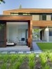 CCS Architecture designed this 5,800-square-foot home for a family of five in Palo Alto, California. The home’s bent, linear configuration divides the site; the public-facing, street sides wrap the corner, creating a more private interior. A breezeway leads to the entry and the yard beyond, while also separating the main house from the garage and guest studio, which opens directly out to the garden with large sliding doors. Photo 10 of Palo Alto Residence modern home