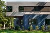 Modern home with Exterior, House, Wood Siding Material, Prefab Building Type, and Flat RoofLine. exterior facade and cantilever Photo 3 of Springs Residence