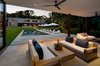 Modern home with Outdoor, Back Yard, Swimming Pools, Tubs, Shower, Concrete Patio, Porch, Deck, Pavers Patio, Porch, Deck, Trees, Shrubs, and Grass. poolhouse Photo 18 of Springs Residence