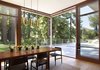 Modern home with Dining Room, Table, Light Hardwood Floor, Chair, and Pendant Lighting. Dining room with intimate connections to groves of redwood trees Photo 5 of Mt. Tam House