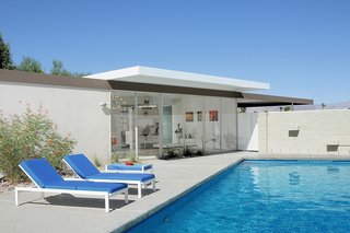 Natural light is a given in this home, since each major room features floor-to-ceiling glass panels and sliding doors that are all eight feet high. The pool also has an automatic retractable cover. 