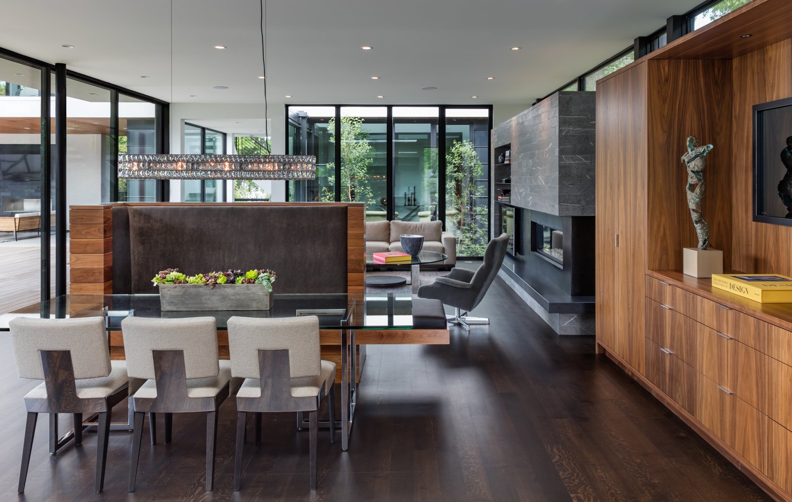Photo 4 Of 6 In An Indoor Outdoor Home Minneapolis Defies A Harsh Dining Room Table Ceiling Lighting And Dark Hardwood Floor Keller Martin Also