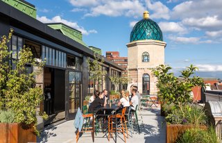 The open patio on the fourth level of the building lends itself well to the modern idea of a workspace. 