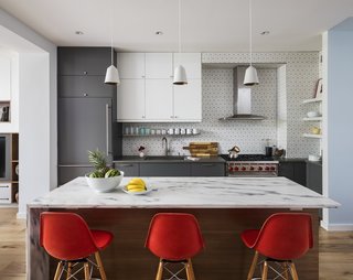 “We chose a gray veined marble (Vermont Royal Danby, from ABC Worldwide) for the kitchen counter,” Barker says. “We found bleached walnut floors from Madera to tie the parlor floor together.”