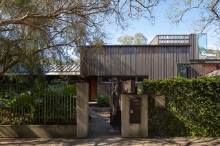 "The wood exterior was selected to make the house blend in with the landscape," Troyer says. "I wanted something that didn’t require painting and aged in a way that would provide a degree of richness. " He envisioned a garden that better surrounded the home, and a more modern exterior. He used ash wood slates of various dimensions from Thermory USA, which were heat-treated for a more sustainable finish.