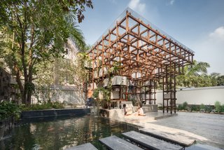 This library's fish pond serves a dual purpose: it teaches visitors about aquatic farming, and  provides water for the surrounding hydroponics.