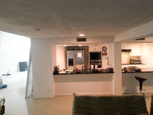 The original kitchen was haphazardly combined from two spaces in previously separated units. 