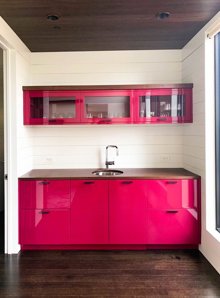 Still want a white kitchen but with an edge? Newman suggests this small-space example as inspiration for a true pop of color. "I don't think there are any rules when selecting colors for cabinetry," she says.
