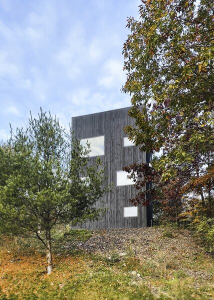The three-story home is perched on a hill in the Catskills.