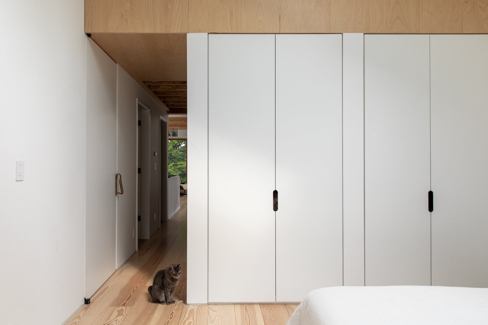 Custom closets line one wall in the primary suite, and are tucked into open areas throughout the home. "When you live in New York, you have to be very efficient with storage,