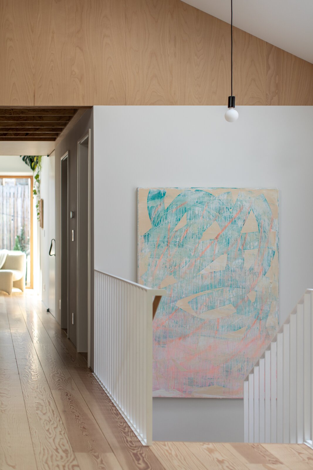 A professional painter who is also a close friend gave them a custom artwork, which fits their staircase perfectly, as a housewarming present.