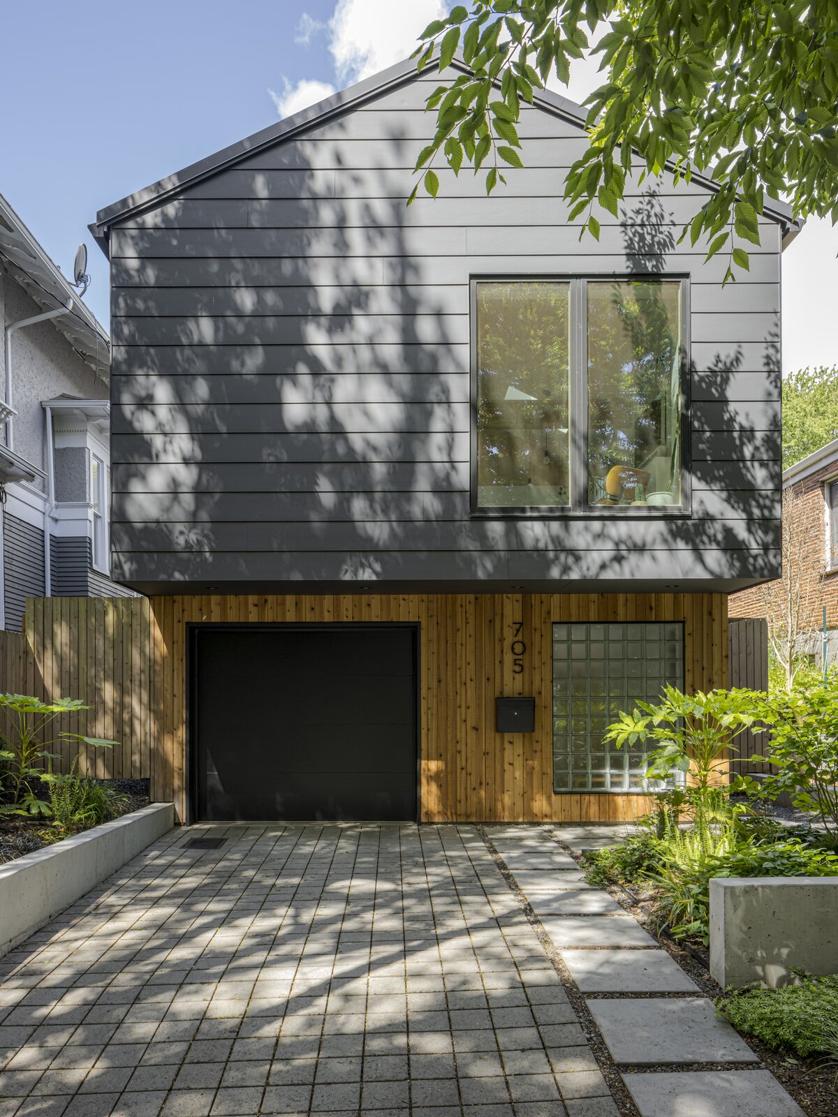 The minimalist exterior complements the rest of the inside, with a fun play on materials and intersecting lines.