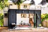 Modern home with Exterior, Flat RoofLine, Metal Siding Material, and House Building Type. Exterior view - doors open Photo of Ballard Residence