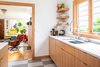 Modern home with Kitchen, Engineered Quartz Counter, Wood Cabinet, Linoleum Floor, Undermount Sink, Recessed Lighting, and Ceramic Tile Backsplashe. Kitchen Photo 4 of Ballard Residence