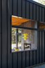 A peek into the "outdoor room" with double-sided fireplace. Photo 2 of Lot 6 modern home