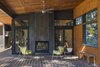 The outdoor living/dining room with double-sided fireplace. Photo 3 of Lot 6 modern home