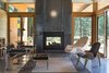 The interior living room, on the reverse of the double-sided fireplace. Photo 4 of Lot 6 modern home