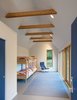 Modern home with Kids Room, Bedroom, Bed, Toddler Age, Bunks, Pre-Teen Age, and Neutral Gender. An existing structure was moved, remodeled, and repurposed as a bunkroom. Photo 7 of The Coyle