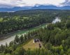 Modern home with Outdoor, Trees, Woodland, and Grass. An existing meadow provided an ideal location for the three structures. Set high above the water, the clearing is surrounded by a dense forest of Douglas fir. Photo 9 of The Coyle