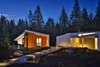 Modern home with Exterior, House Building Type, and Metal Siding Material. At night, the studios are lightboxes against the dark forest. Photo 2 of Whidbey Artists' Retreat