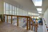 Modern home with Office, Shelves, Craft Room Room Type, Storage, Desk, Chair, Concrete Floor, Library Room Type, and Study Room Type. Far from precious yet finely detailed, the industrial aesthetic of the studios' interiors is softened with a flood of natural light from the polycarbonate clerestories and skylights. Photo 7 of Whidbey Artists' Retreat