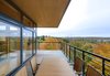 Modern home with Outdoor, Metal Fences, Wall, Side Yard, Wood Patio, Porch, Deck, Large Patio, Porch, Deck, Trees, Decking Patio, Porch, Deck, and Walkways. The expansive cantilevered decks let the clients enjoy the view they love from thirty feet above the ground. Photo 9 of Tower House