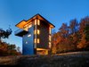 Modern home with Exterior, Metal Siding Material, Metal Roof Material, Wood Siding Material, Flat RoofLine, and House Building Type. Standing seam siding gives a durable exterior finish, with plywood panels adding warm accents. Photo of Tower House
