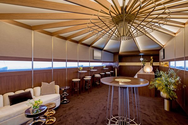 Wood beams converge at what&rsquo;s meant to be the North Pole, while "windows" look out to a frozen landscape.