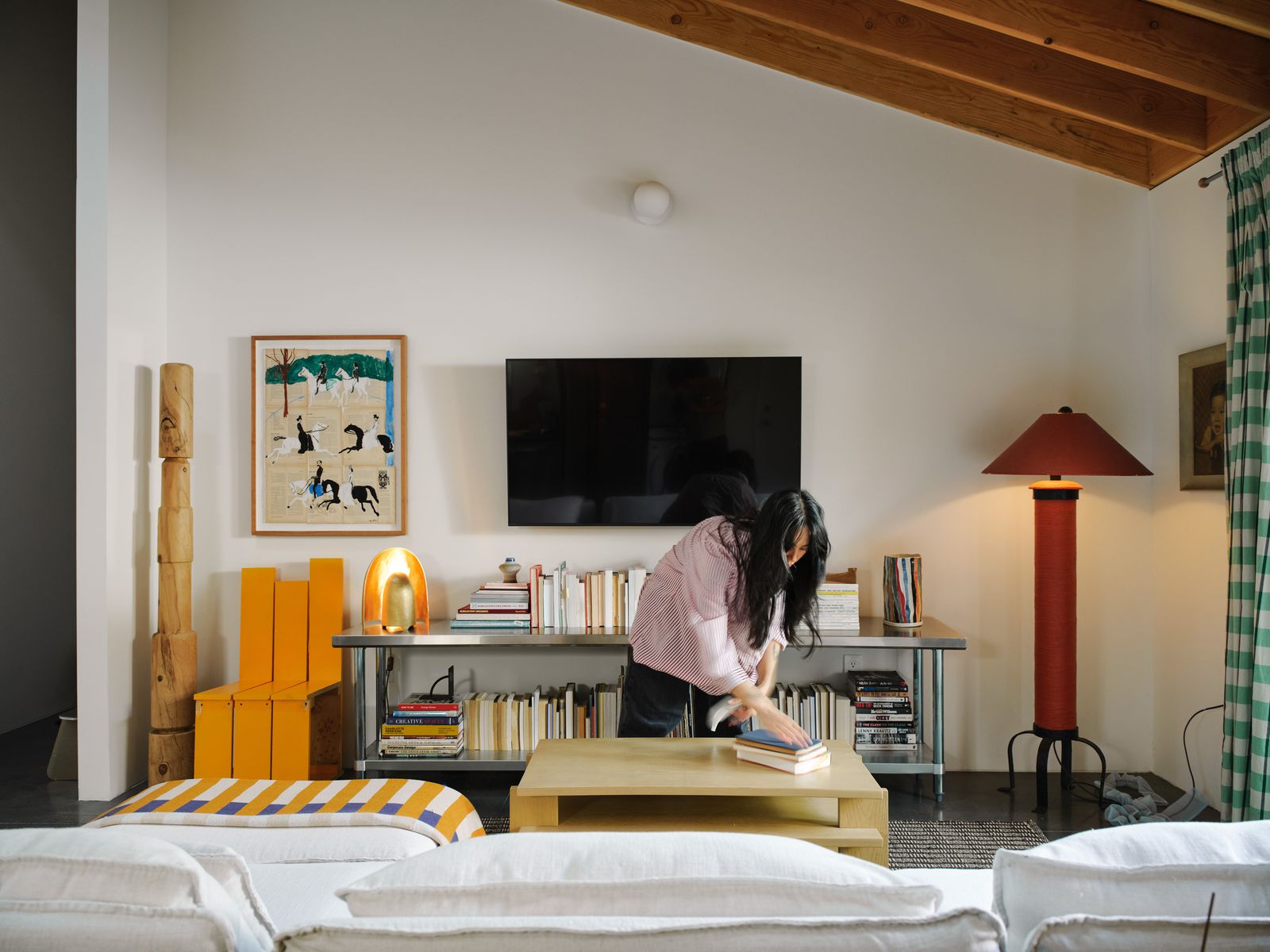 "We’ve got these tall walls and we’ve got a lot of artwork, and one thing I’ve learned on my rental journey is how to hang artwork without marring walls,