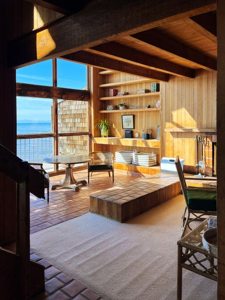 Though it boasted expansive views, the living room, like the rest of the house was cold and drafty.