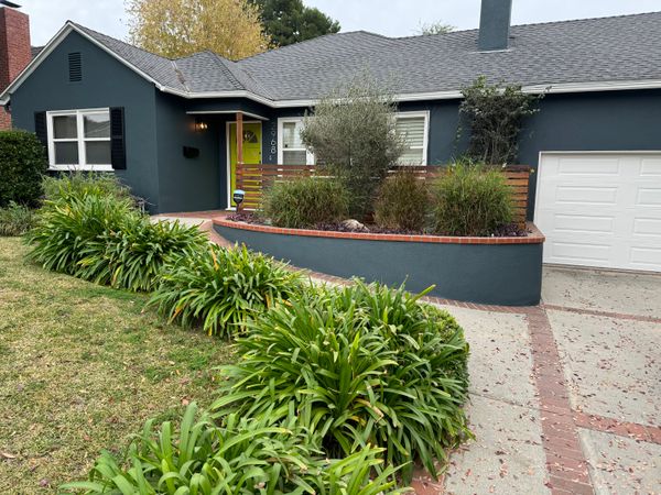 The sloping walkway to the front door was a big selling point when Katherine, who uses a wheelchair part of the time, first saw the house. Slowly she made the place her own—painting the exterior and adding a front porch where she could sit and talk to her neighbors, and creating an accessible kitchen.