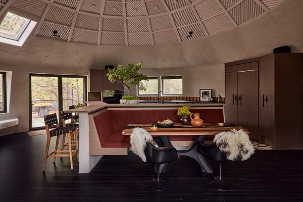 Prewitt designed the dining banquette, which was built by Wood Design, and stained the floors black. 