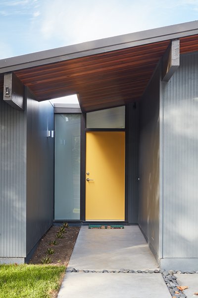 Klopf Architecture preserved the vertical “thinline” wood siding, and matched it in kind at the front addition.