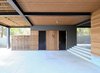 Outdoor shower, bathroom, and storage below house Photo 13 of North Fork Bay House modern home