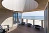 Modern home with Wood Patio, Porch, Deck, House Building Type, Wood Siding Material, and Outdoor. The oculus deck serves as an oversized sun dial Photo 8 of Dune Road Beach House