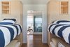 Modern home with Medium Hardwood Floor. Bunk room with oculus deck and ocean beyond Photo 12 of Dune Road Beach House