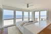 Modern home with Bedroom, Ceiling Lighting, and Medium Hardwood Floor. Master bedroom Photo 13 of Dune Road Beach House