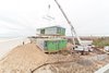 Second-floor module being set as seen from neighboring house Photo 18 of Dune Road Beach House modern home
