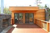 Ipe roof deck with outdoor fireplace and stone surround Photo 4 of Catskills Suburban modern home