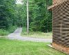 The home is accessed via a long gravel drive through the woods Photo 15 of Catskills Suburban modern home