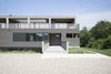 Modern home with Exterior, House Building Type, Green Roof Material, Flat RoofLine, Wood Siding Material, and Prefab Building Type. Entry to home via bridge Photo 2 of North Fork Bluff House