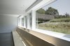 Basement / playroom with bridge to home beyond Photo 16 of North Fork Bluff House modern home