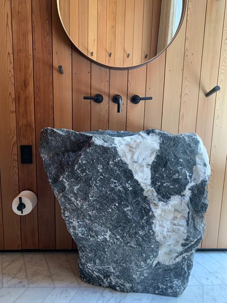 Homeowner and artist Elizabeth Paige Smith selected a large boulder to be made into the bathroom sink.