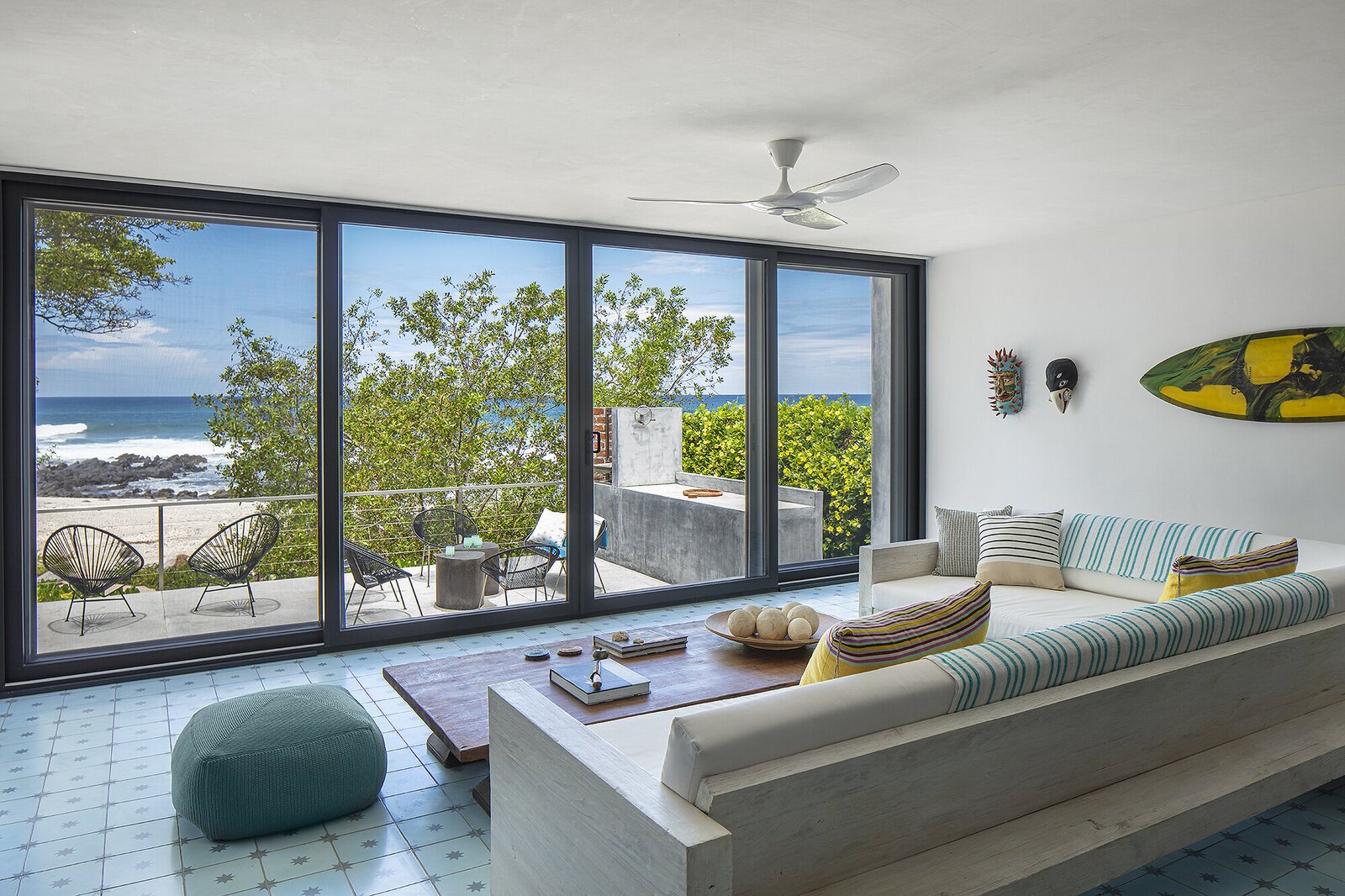 The living room features a sofa constructed by Christopher himself.